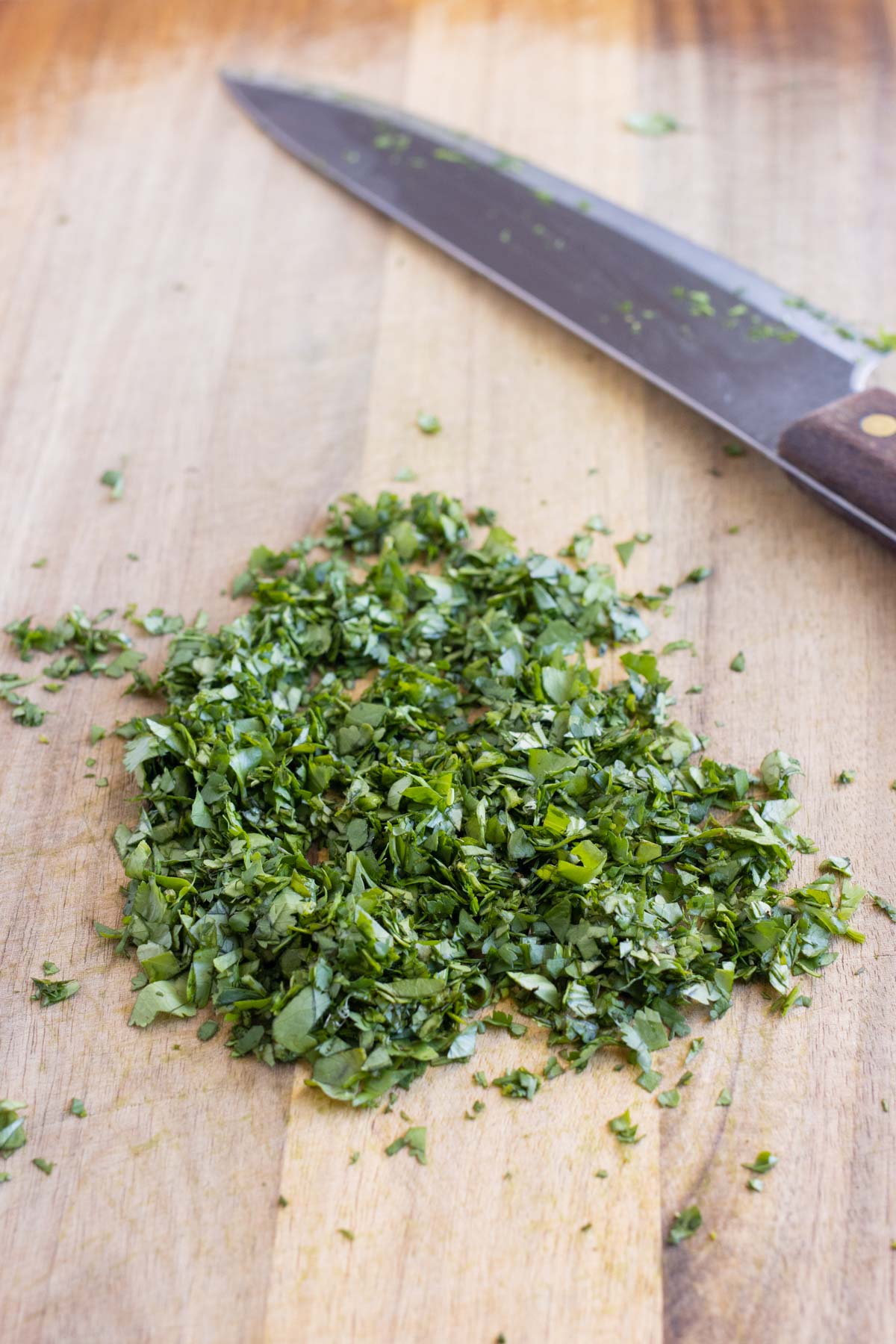 Fresh cilantro is chopped finely.