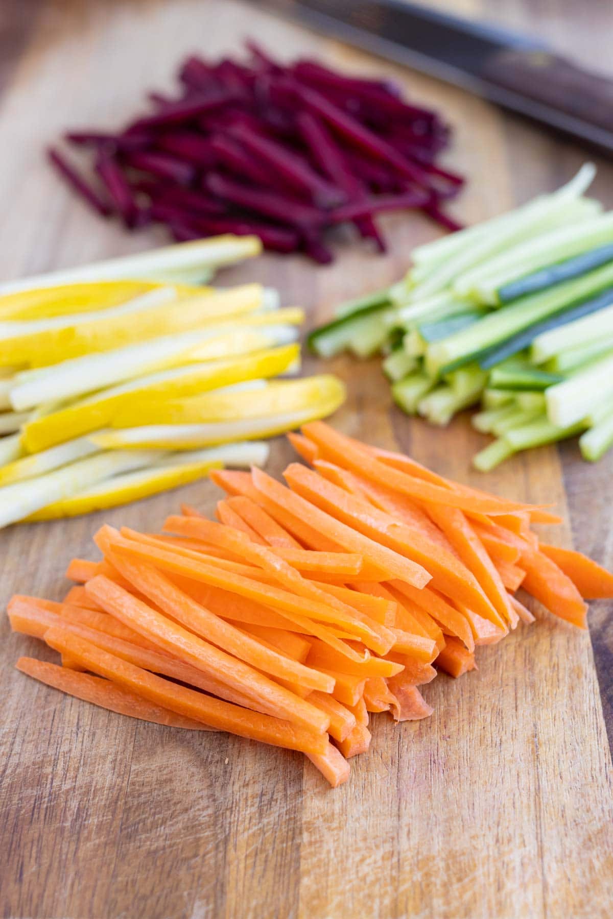 Fresh Julienne cut vegetables are shown before using in a recipe.