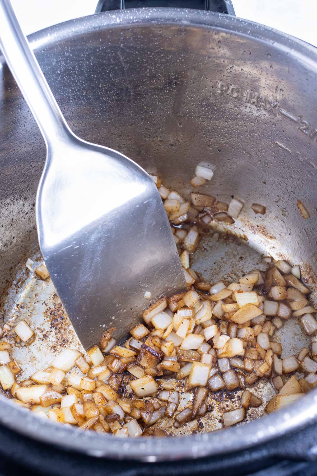 Diced onion is added to the instant pot.