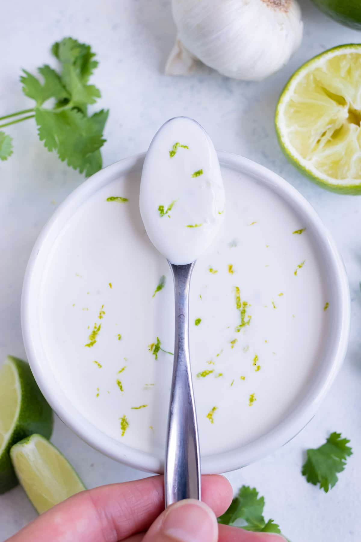 A bowl of lime crema is used as a taco sauce.