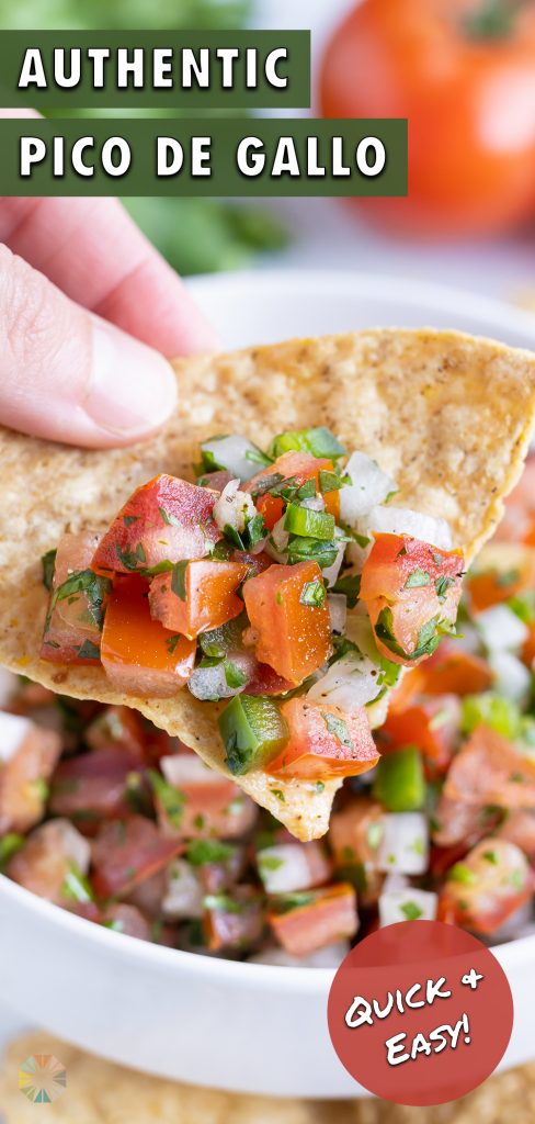 A tortilla chip is loaded with fresh and healthy pico de gallo.