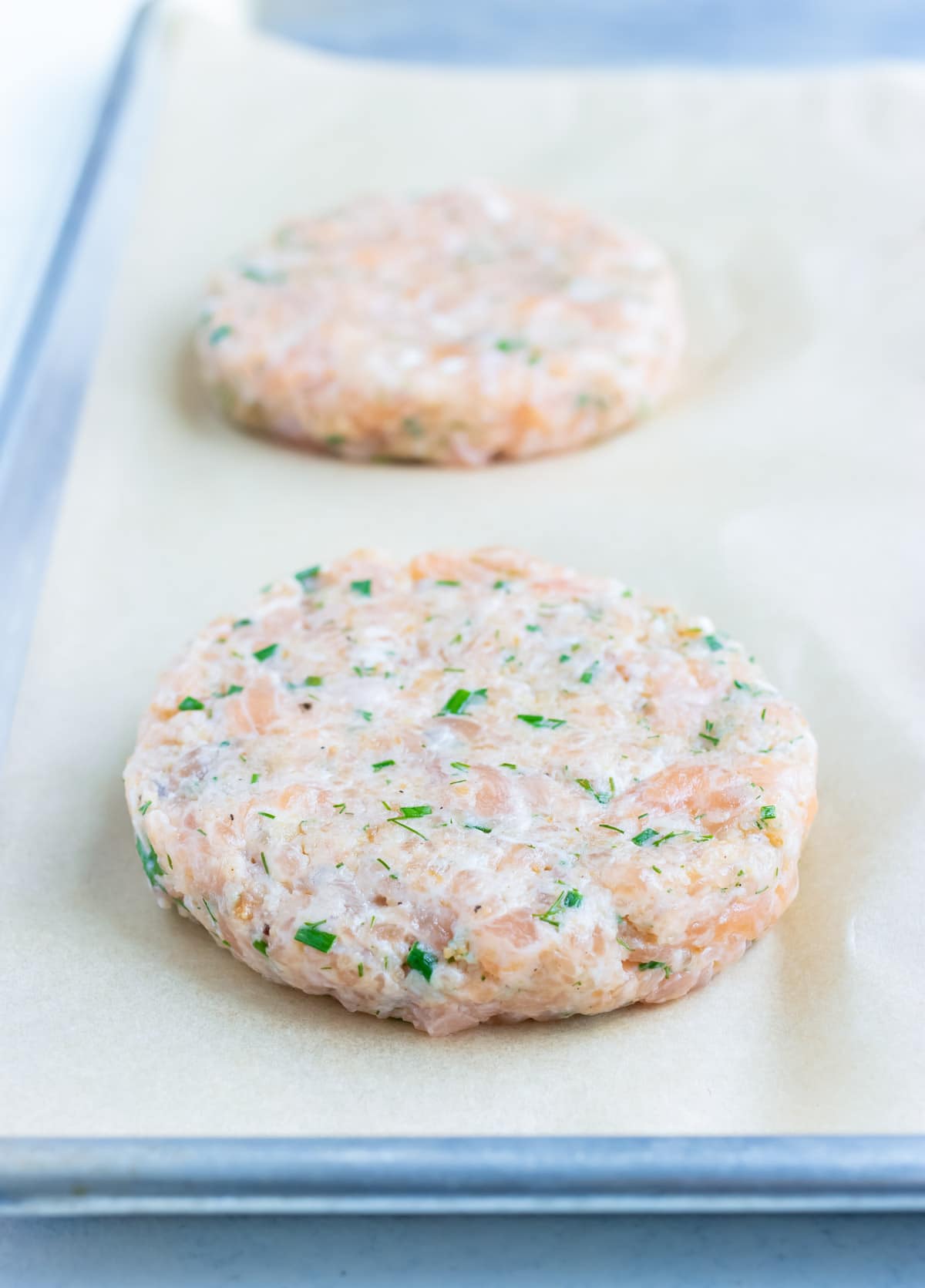 You can place raw burgers on wax paper.