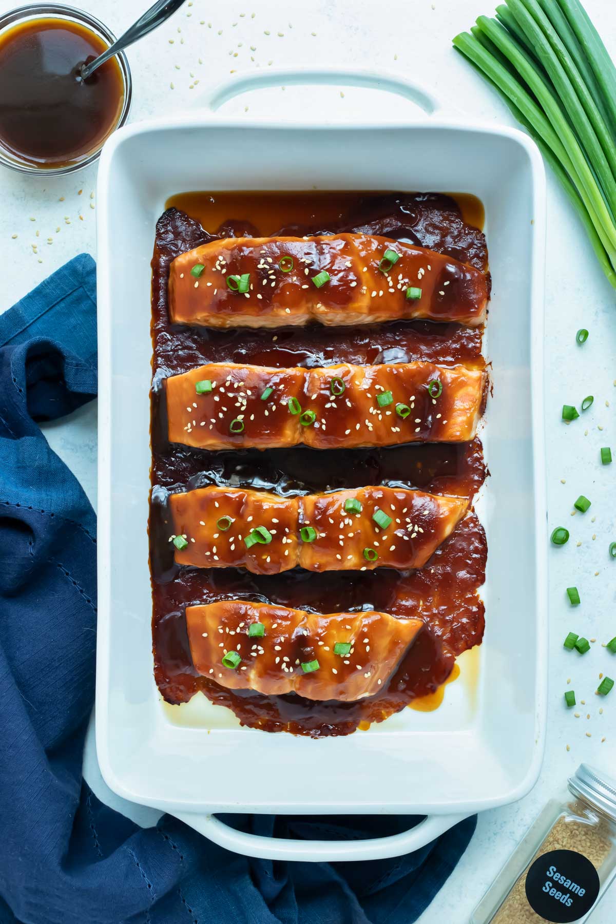 An overhead shot is shown with baked salmon covered in a homemade teriyaki sauce.