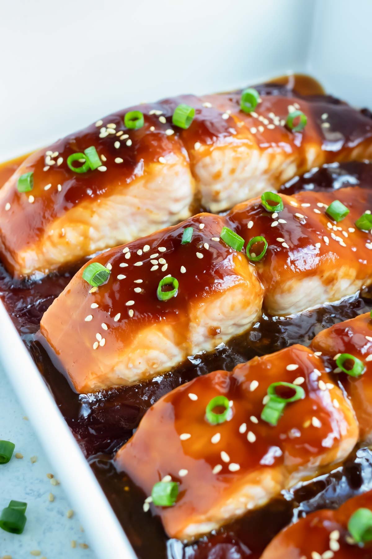 Teriyaki salmon is covered with sweet and tangy teriyaki sauce and sesame seeds.