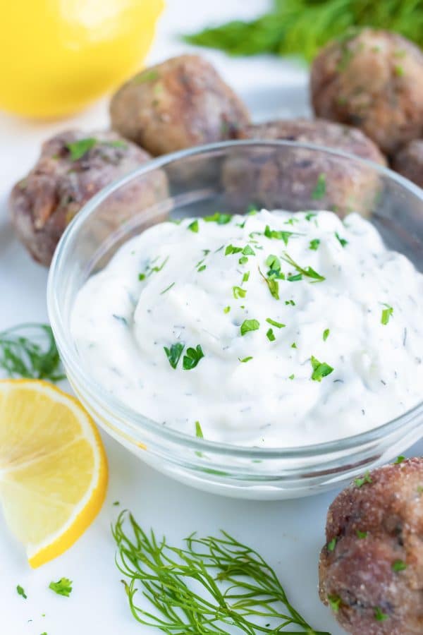Tzatziki sauce is loaded with dill, cucumber, lemon, and greek yogurt for an authentic mediterranean dip perfect for your Greek recipes.