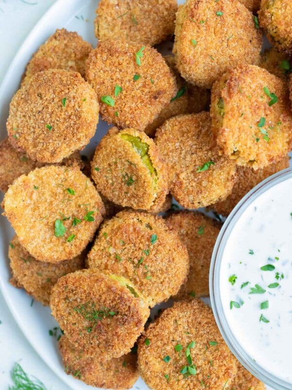 An overhead shot shows a plate of air fryer pickles.