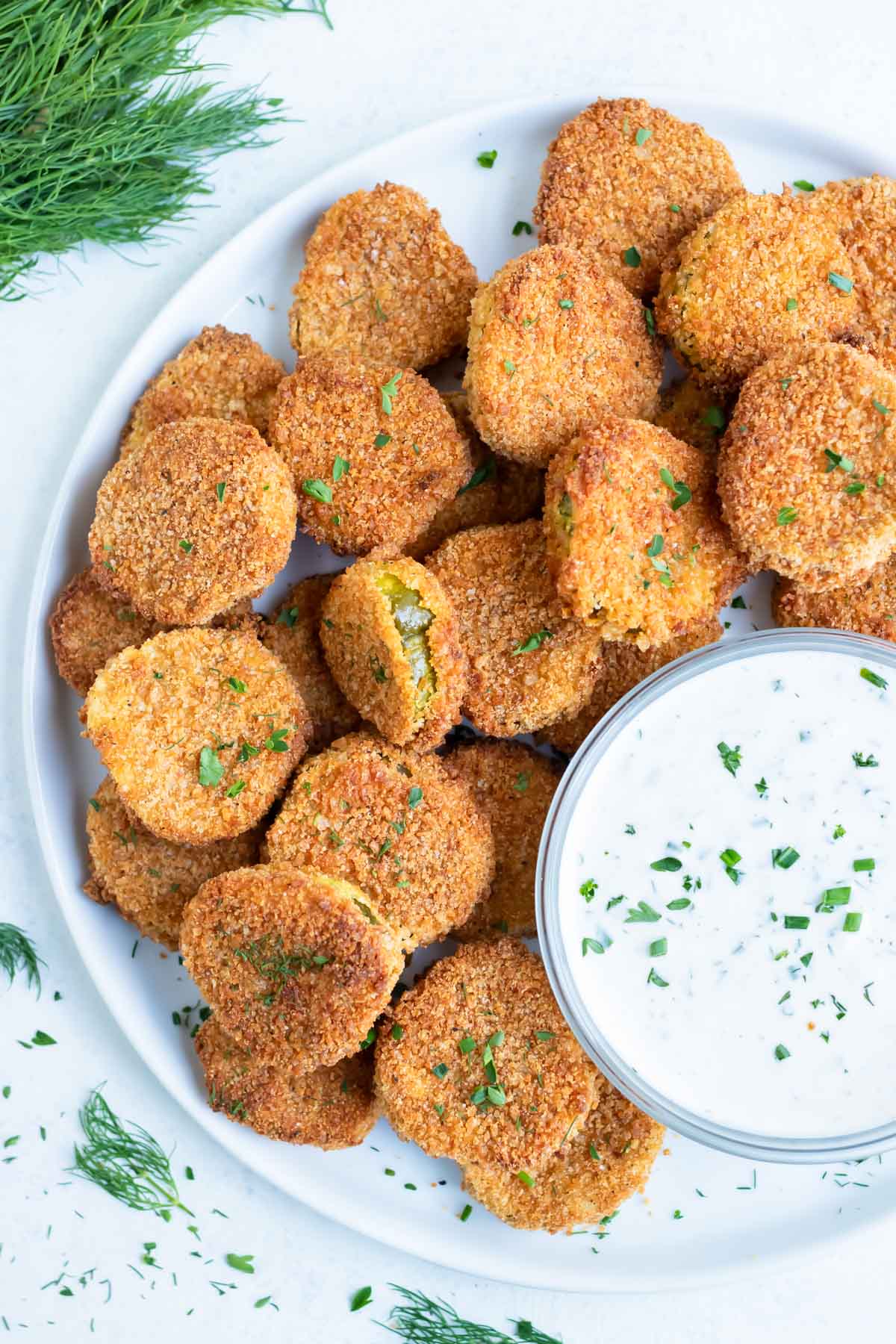 Fried pickles are served for a gluten free appetizer.