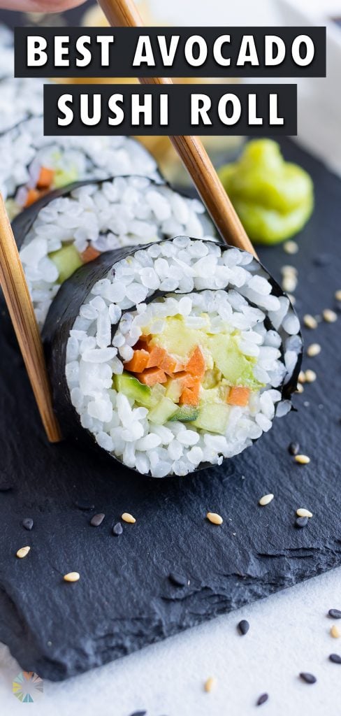 Chopsticks are used to pick up the piece of sushi.