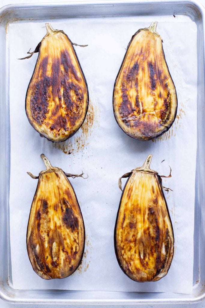 The flesh of the eggplants is golden brown after roasting.