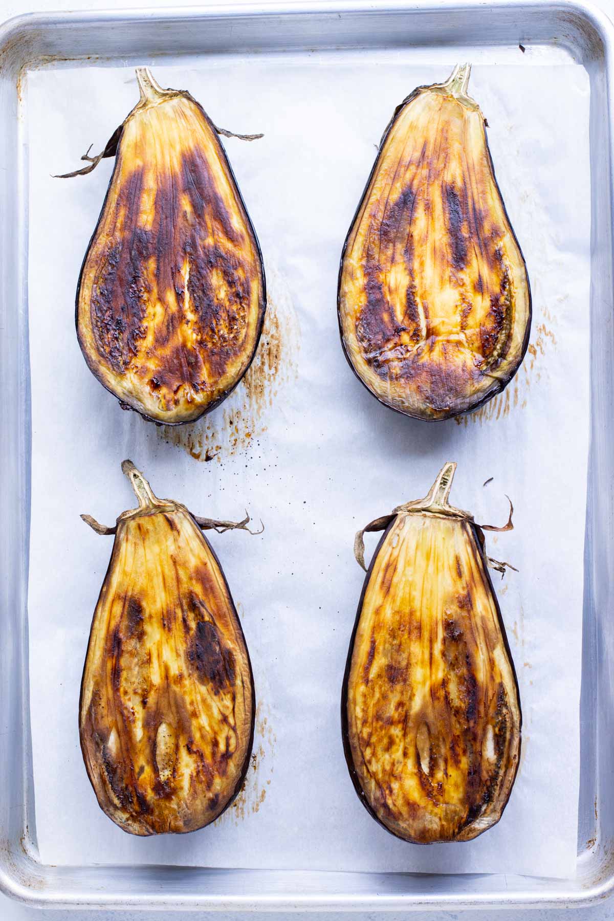 The flesh of the eggplants is golden brown after roasting.