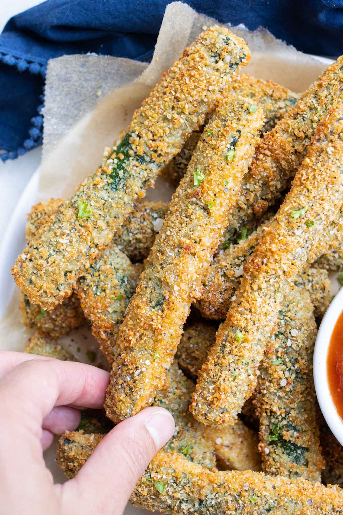 Healthy, vegetarian zucchini fries on a plate.