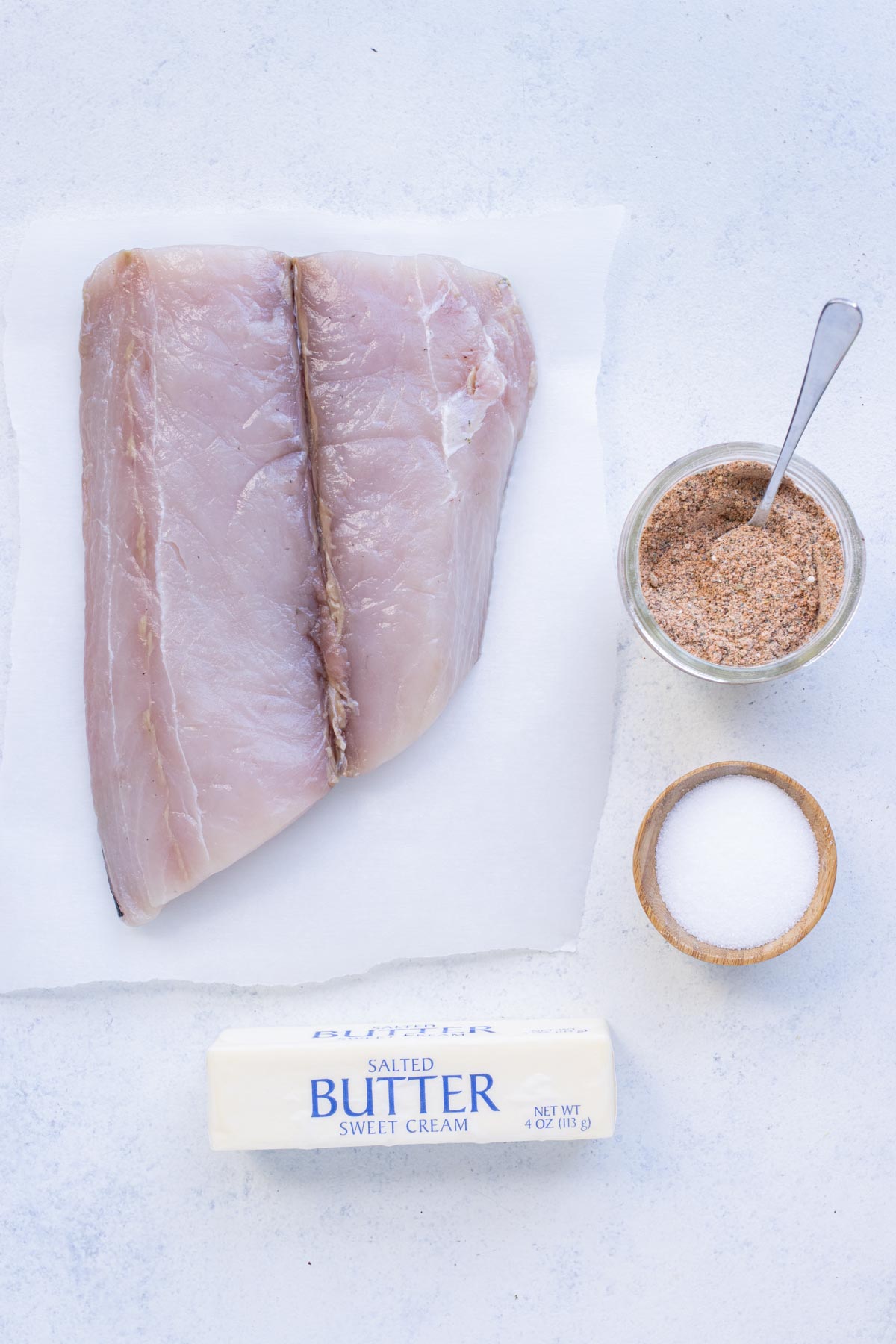 Mahi mahi, blackened seasoning, butter, and salt are the ingredients for this recipe.