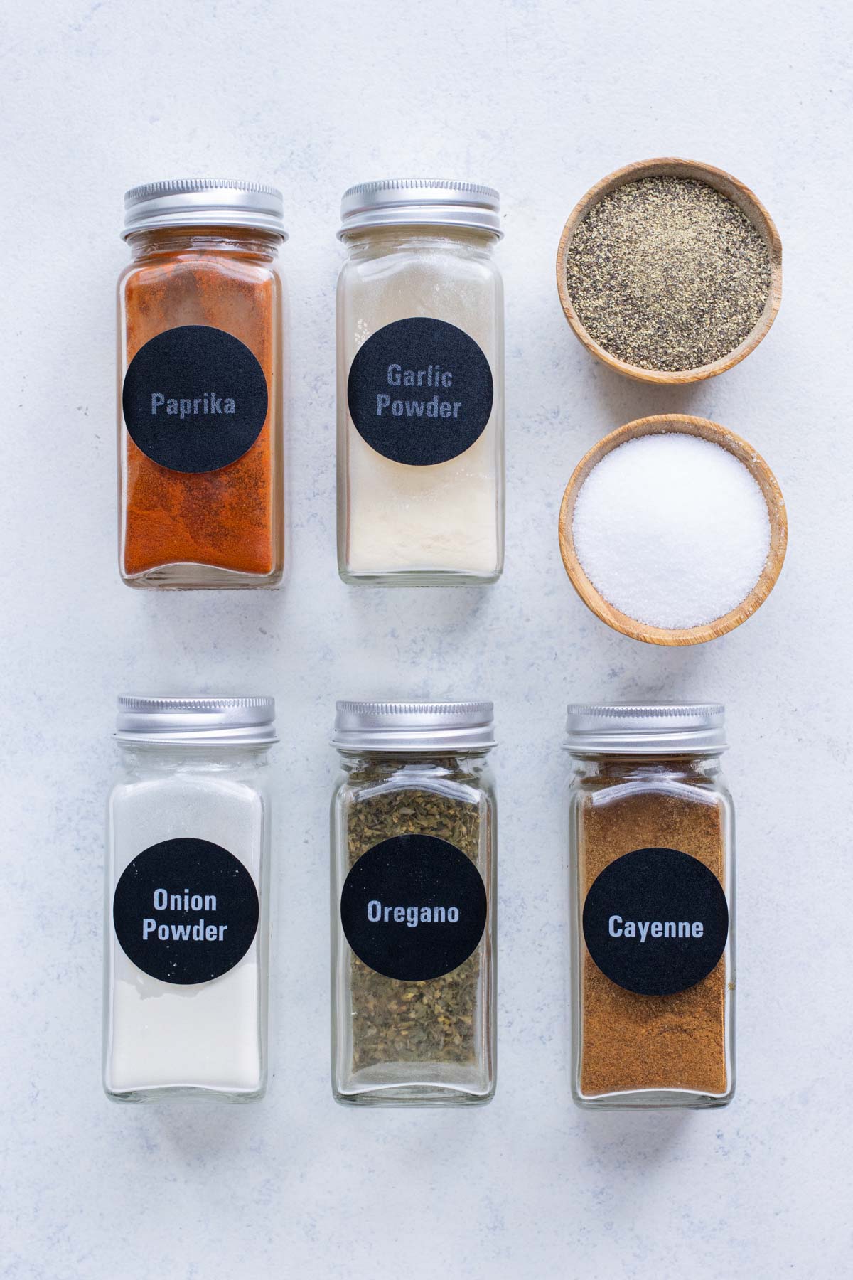 Paprika, garlic powder, onion powder, oregano, salt, black pepper, and cayenne pepper are the ingredients in this burger seasoning recipe.