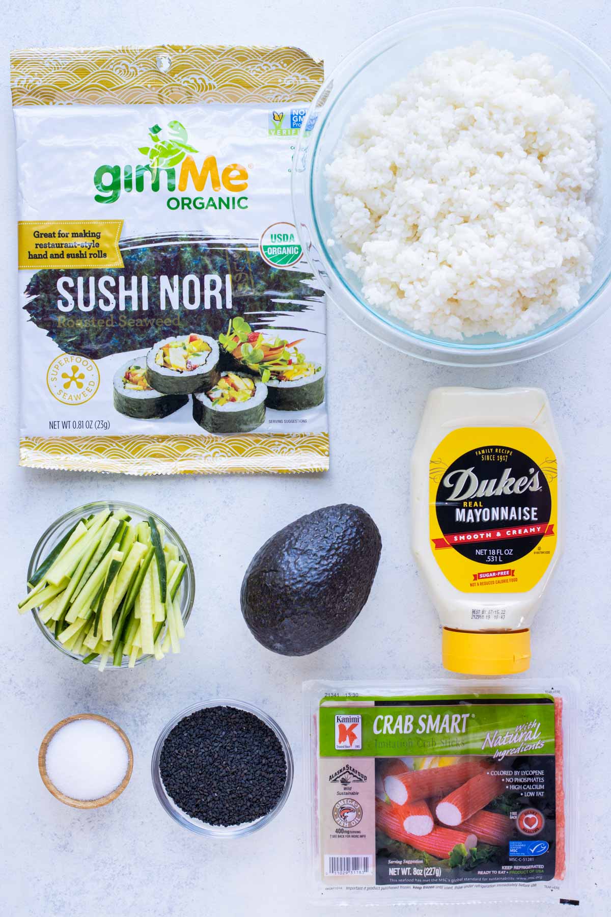 Nori, sushi rice, cucumber, avocado, crab meat, mayo, salt, and sesame seeds are the ingredients in this recipe.