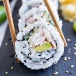 Chopsticks are used to eat sushi rolls.