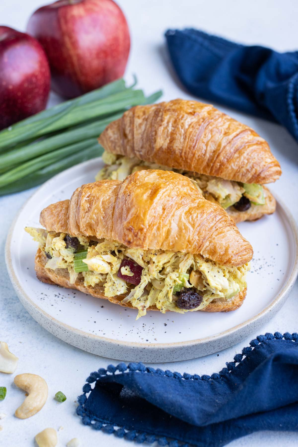 Indian-inspired Curry chicken salad is served inside croissants.