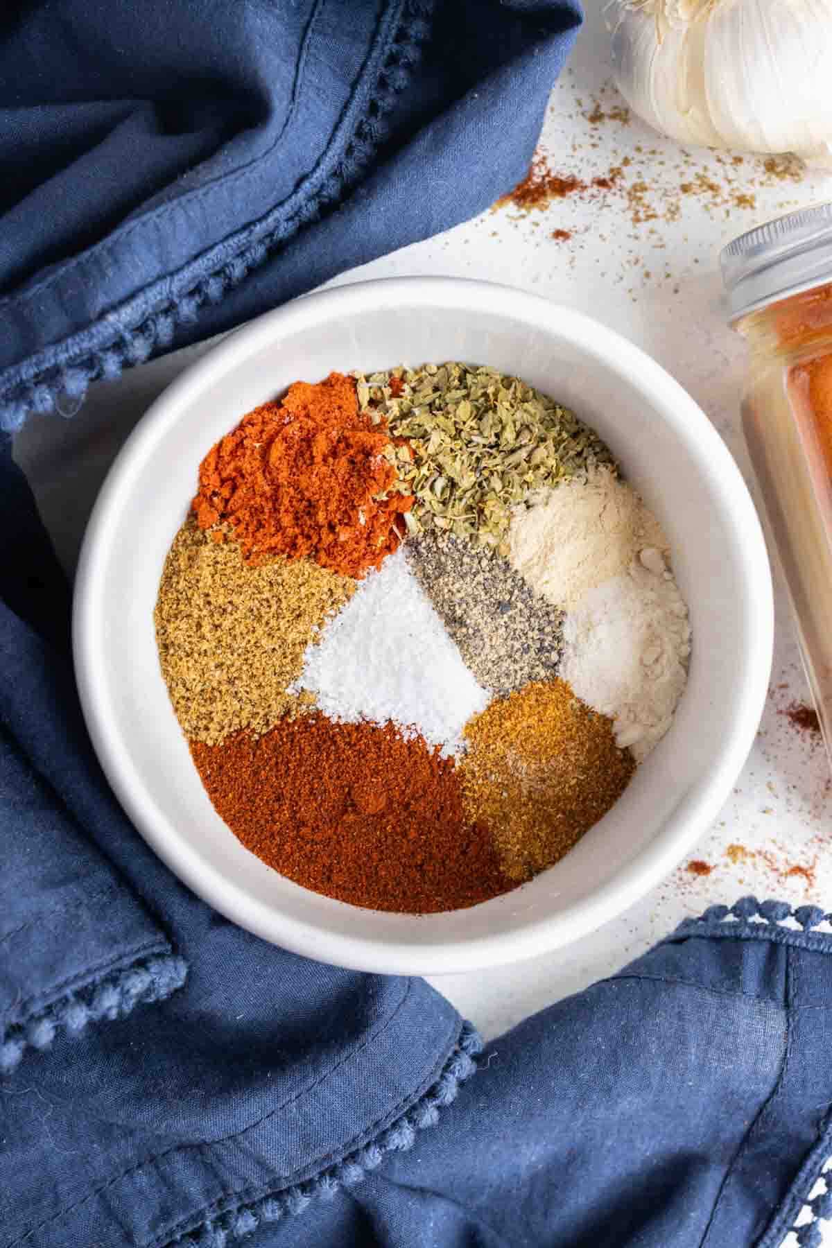 A bowl of different seasonings is shown on the counter.