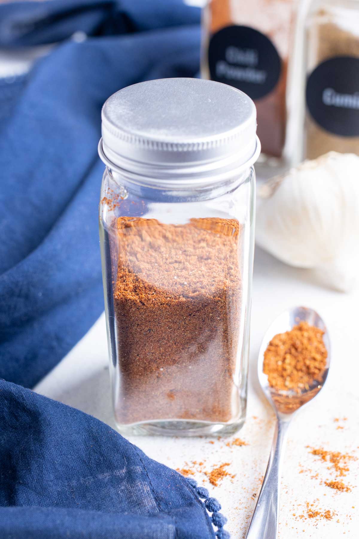 Homemade Fajita Seasoning is stored in a glass jar.