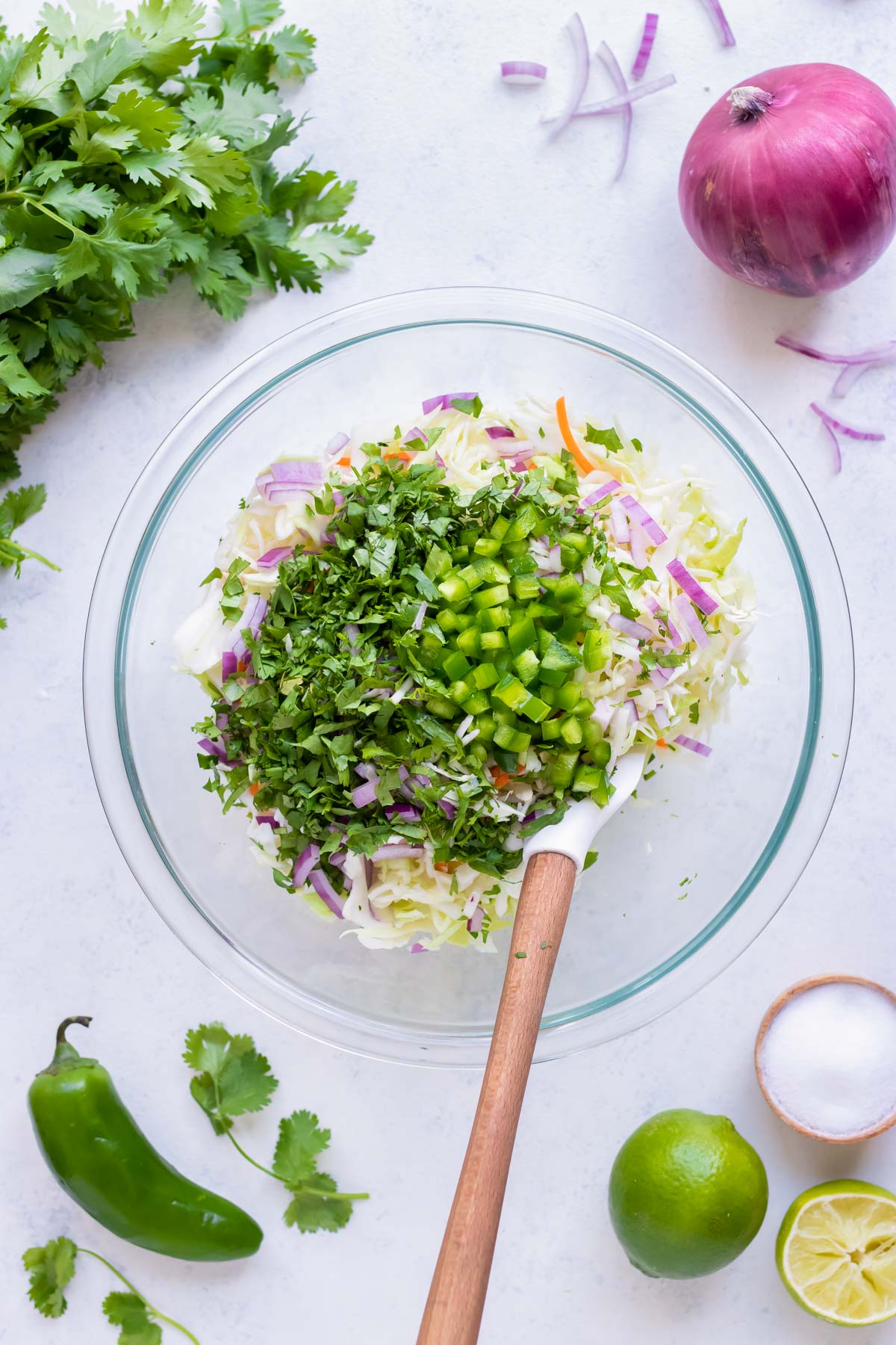 All the ingredients are combined and mixed in a glass bowl.