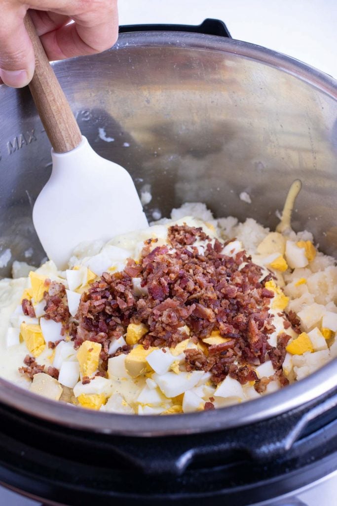 Chopped eggs and crumbled bacon added to mashed potatoes for Southern potato salad.