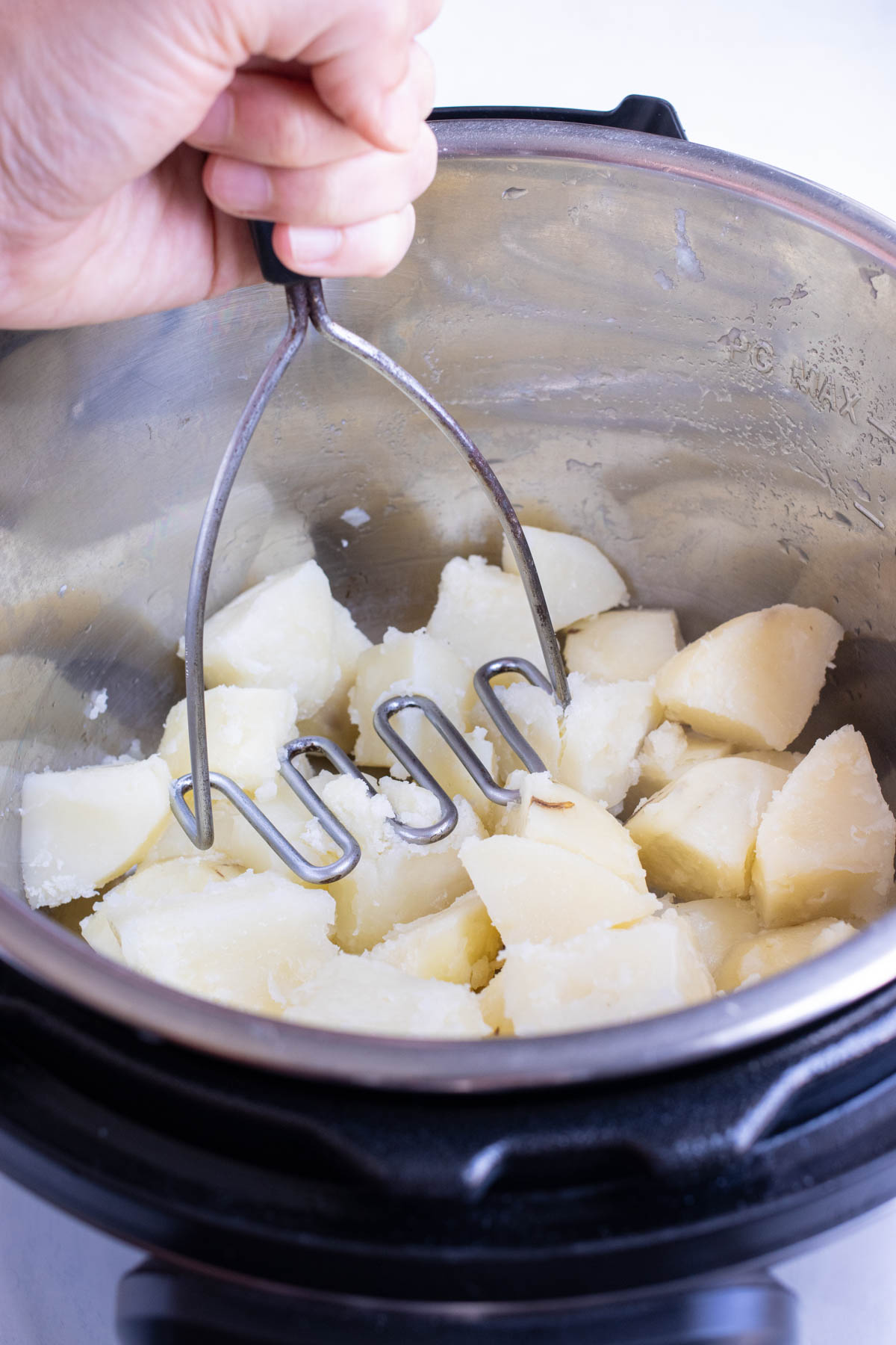 Potatoes are mashed into big chunks.