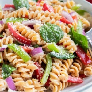 A bowl full of Pasta Salad with Italian Dressing and Parmesan cheese is served up for a simple summer recipe.