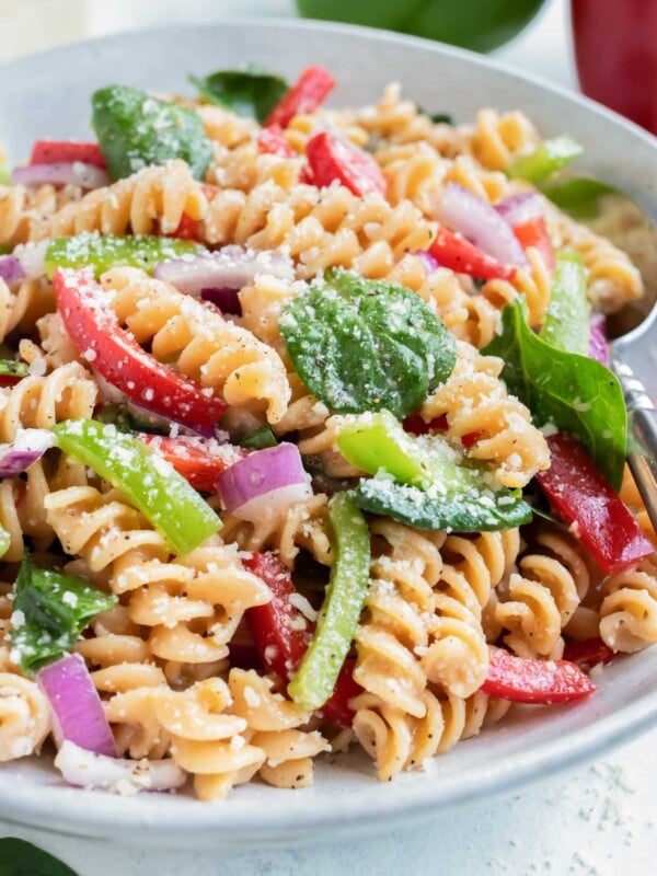 A bowl full of Pasta Salad with Italian Dressing and Parmesan cheese is served up for a simple summer recipe.