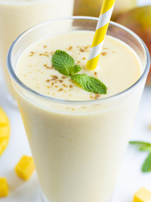A glass is filled with refreshing and healthy mango lassi.