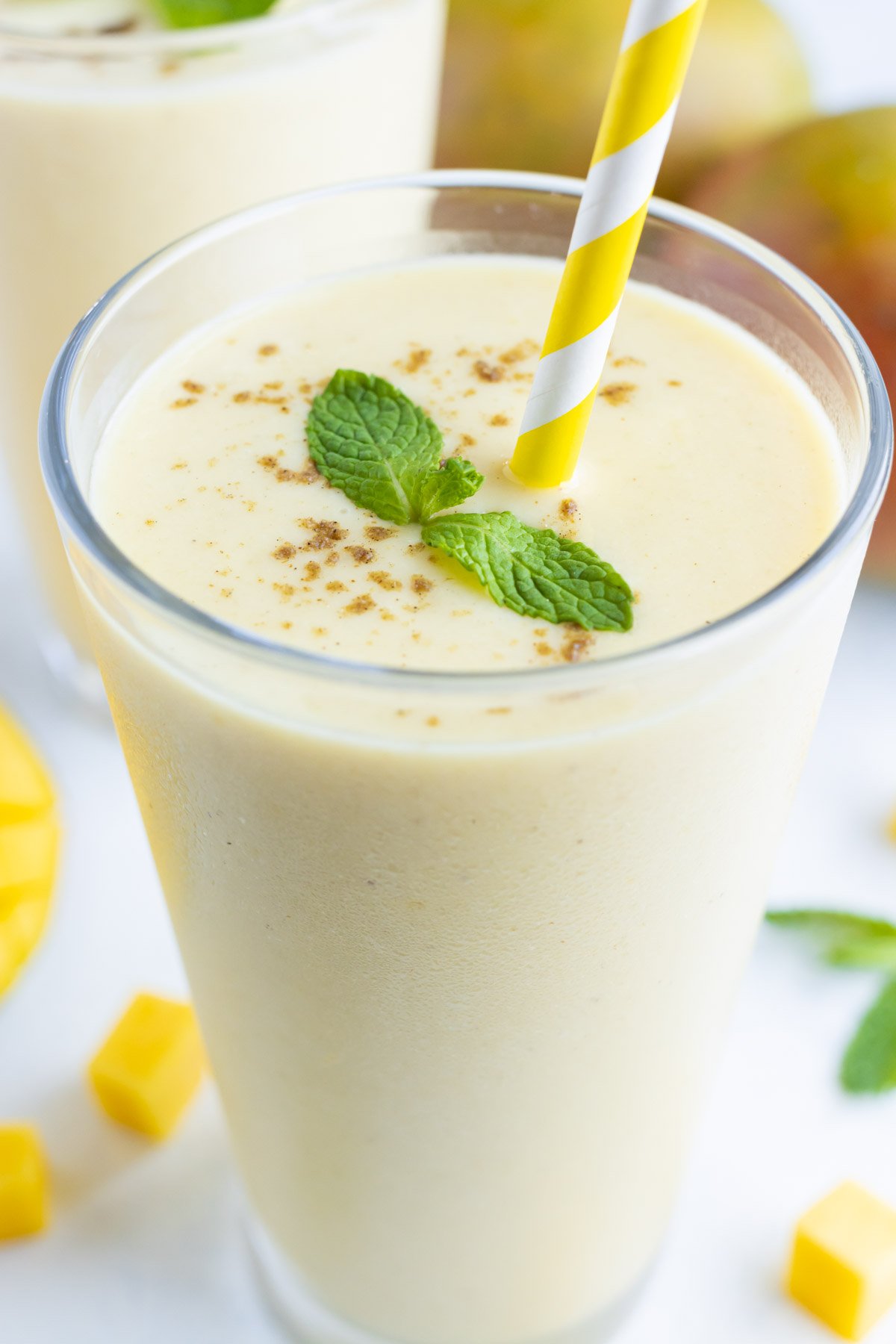 A glass is filled with refreshing and healthy mango lassi.