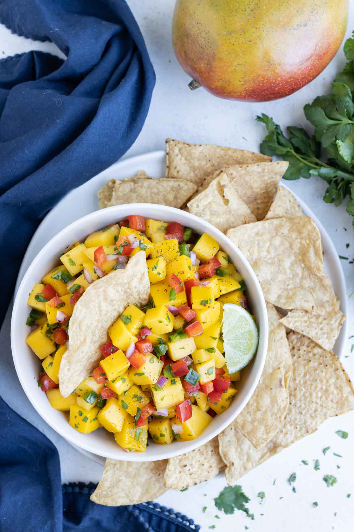 An overhead picture shows mango salsa served with tortilla chips.