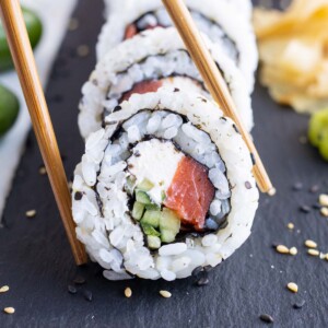 Healthy Philadelphia rolls with salmon and cream cheese is shown on the counter.