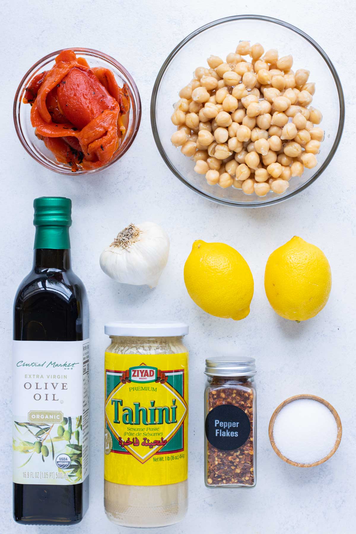 Chickpeas, roasted red peppers, tahini, olive oil, lemons, garlic, and seasoning are the ingredients for this recipe.