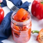 A jar full of healthy, roasted peppers.