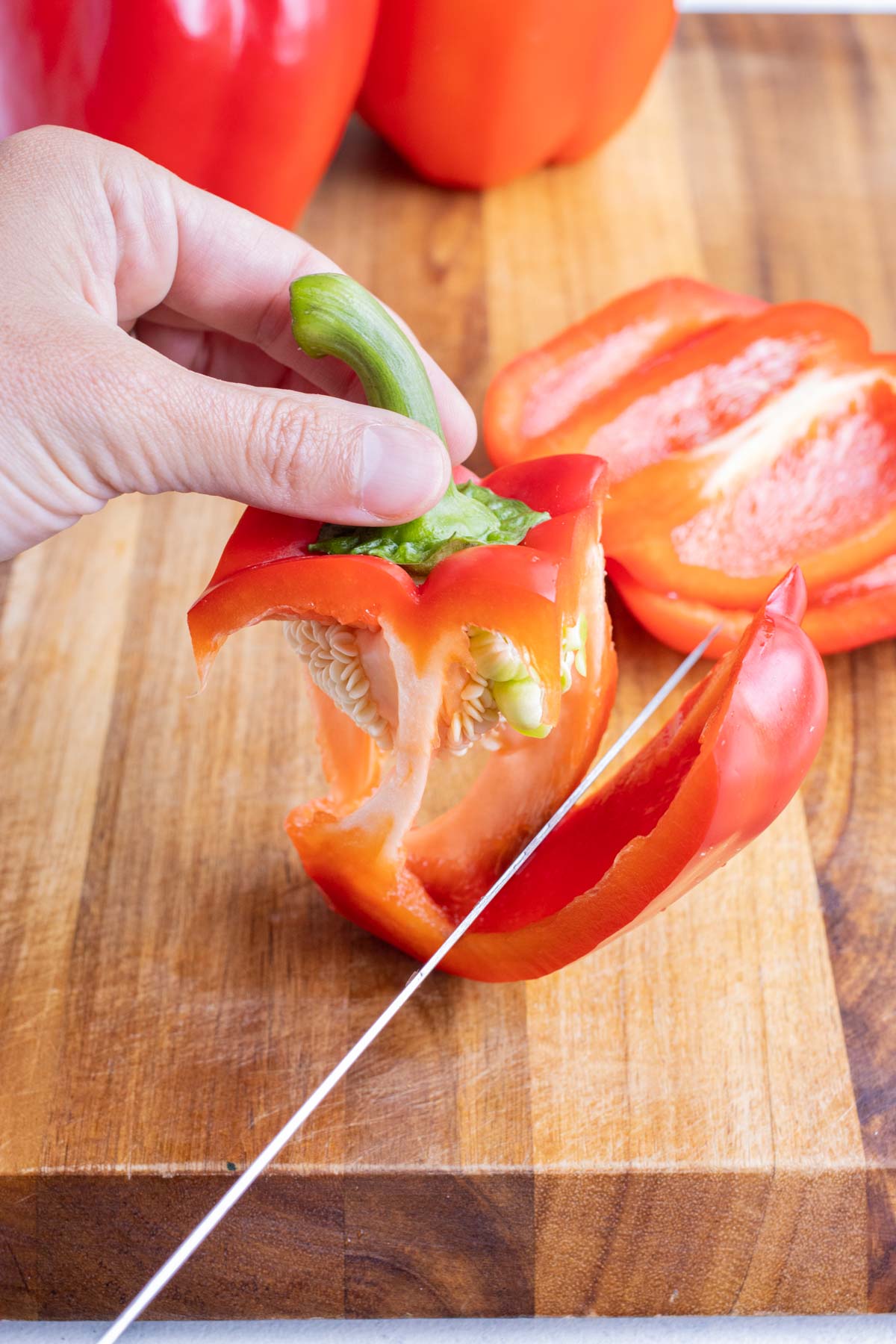 How to remove the sides of a bell pepper around the core.