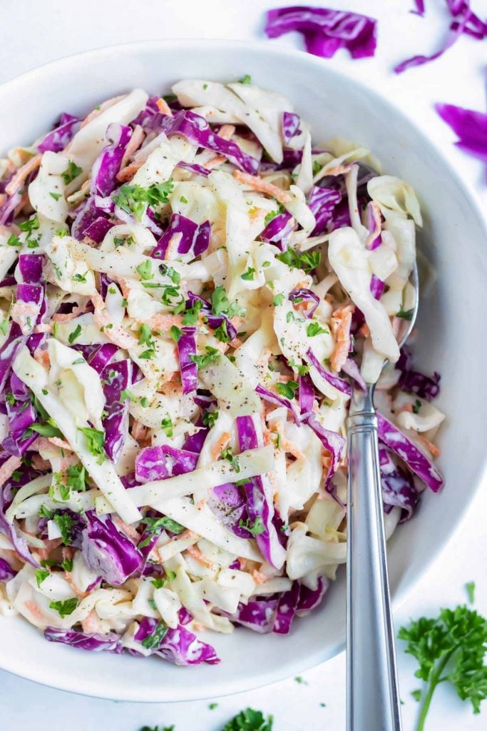 Quick, easy, and healthy coleslaw recipe in a white bowl.