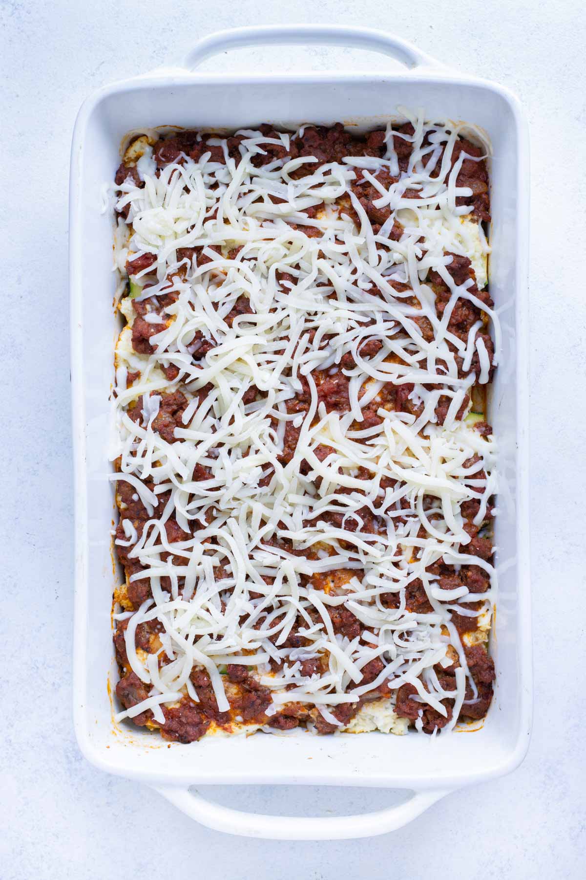 A sprinkle of mozzarella tops the zucchini lasagna.