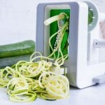 How to use a spiralizer to grate zucchini into zucchini noodles as a pasta alternative.