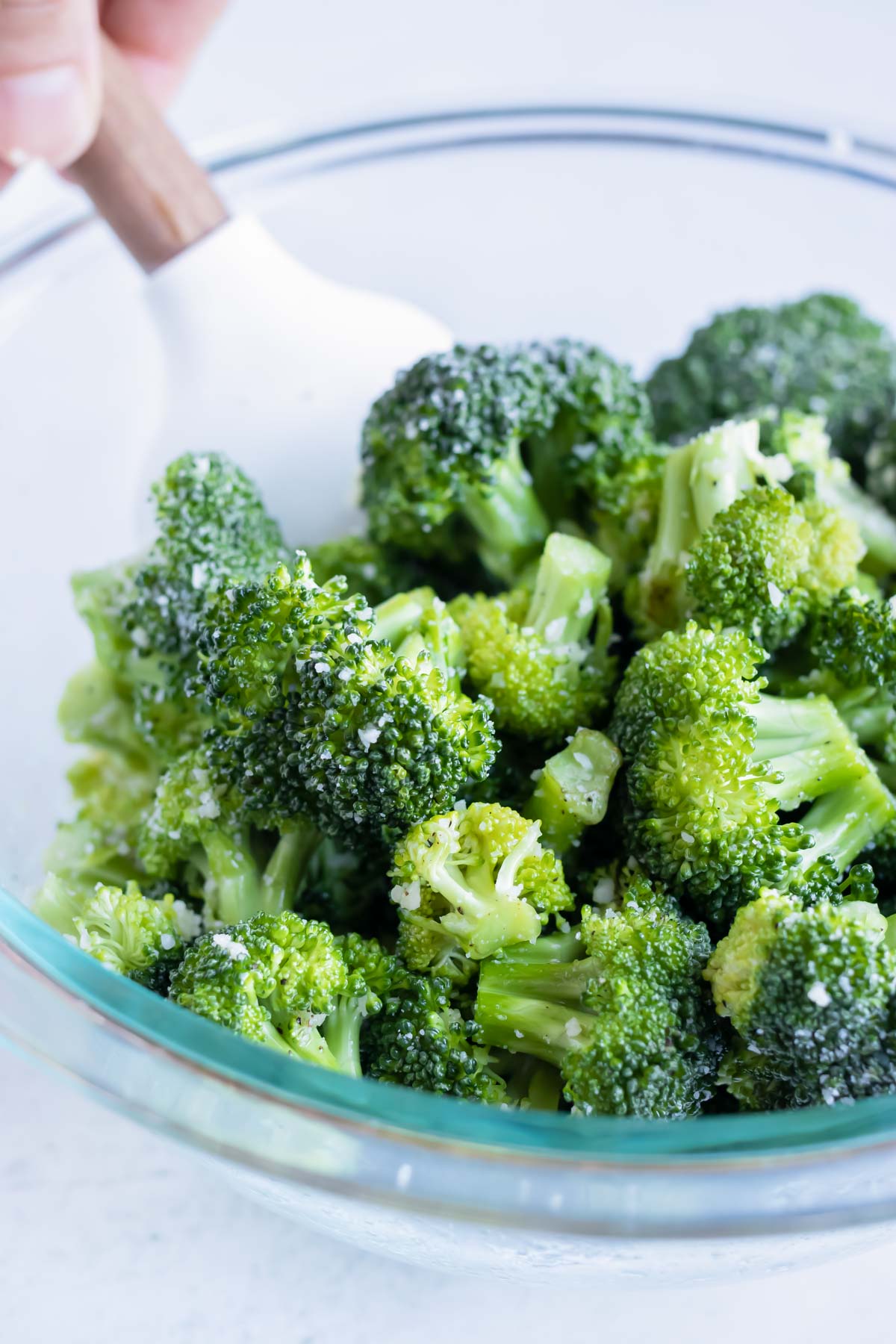 Broccoli florets are covered in an oil and garlic mixture.