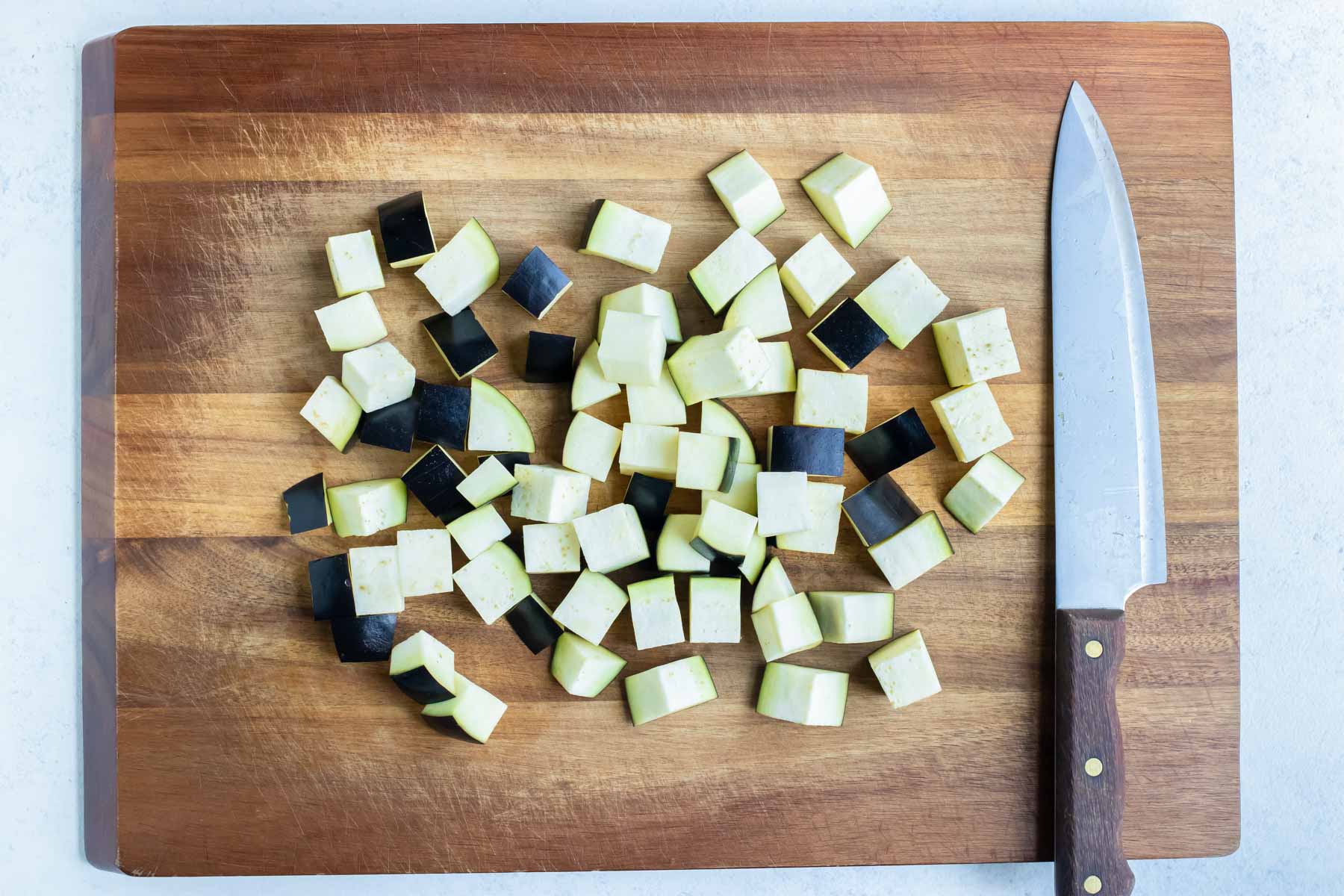 The cubed eggplant is prepared for the air fryer.