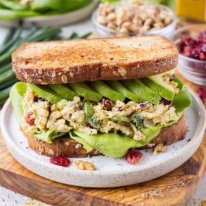 Toasted bread is loaded with curry chicken salad, lettuce, and avocado for a quick and flavorful lunch.