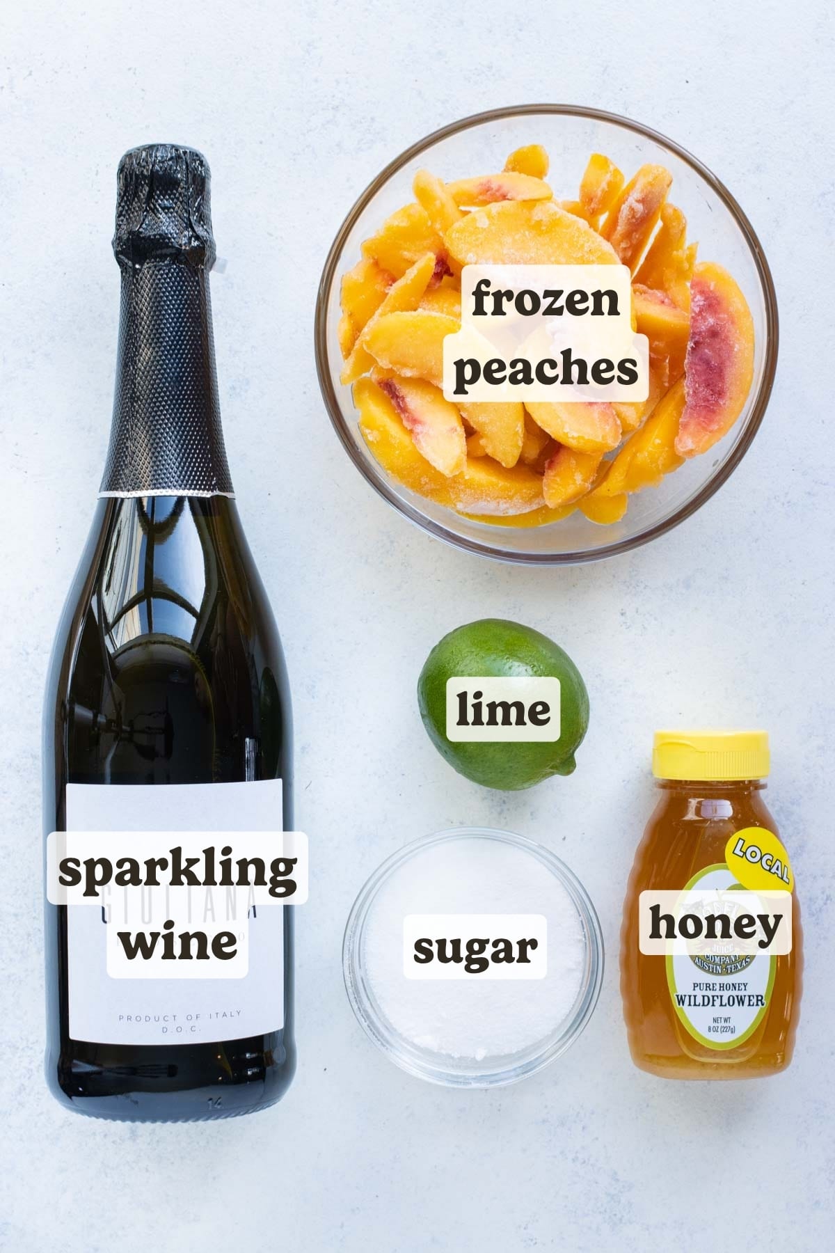 Prosecco, frozen peaches, lime juice, and sweetener are the ingredients needed for this frozen Peach Bellini Recipe.