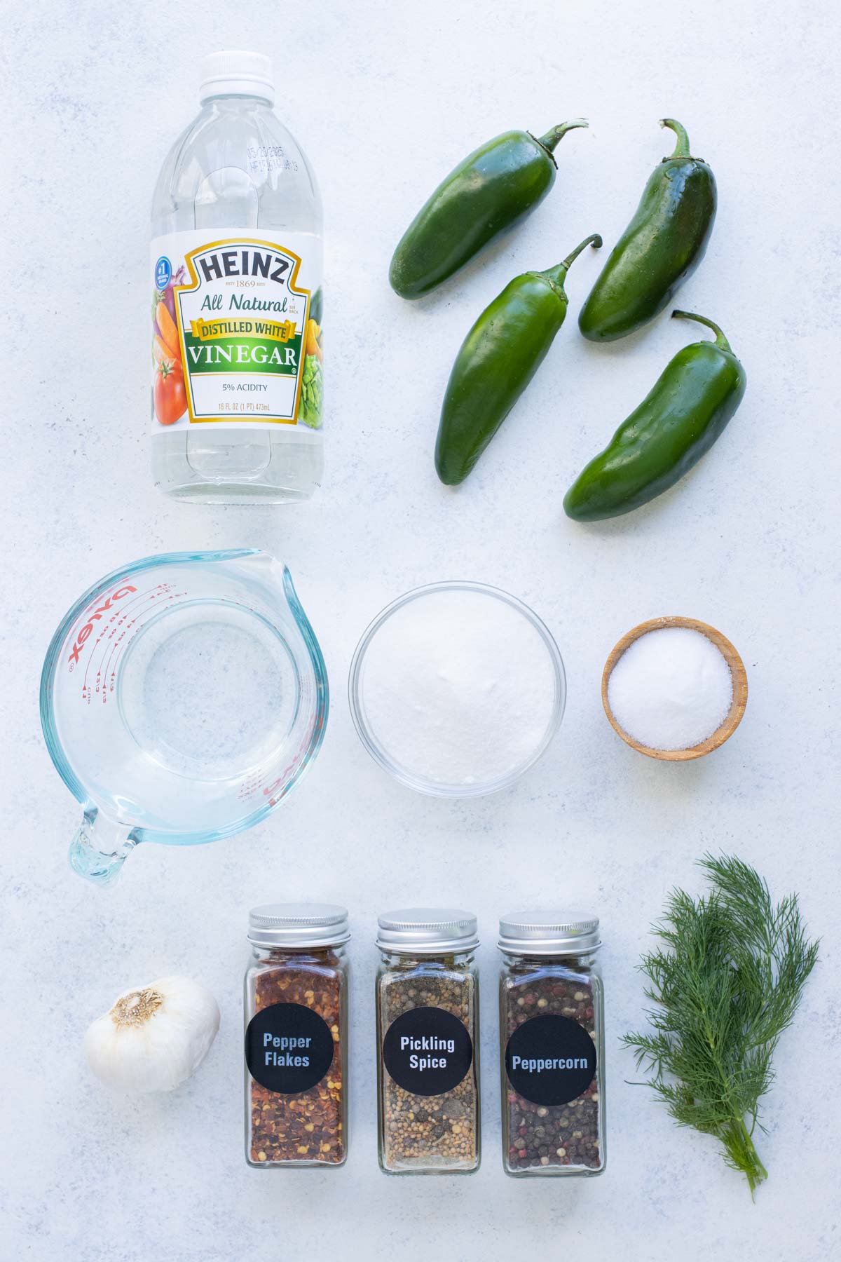 Jalapeños, vinegar, water, sugar, salt, and spices are the ingredients for pickled jalapeños.