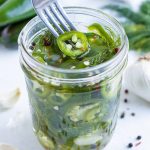 Crisp and flavorful jalapeños in a glass jar.
