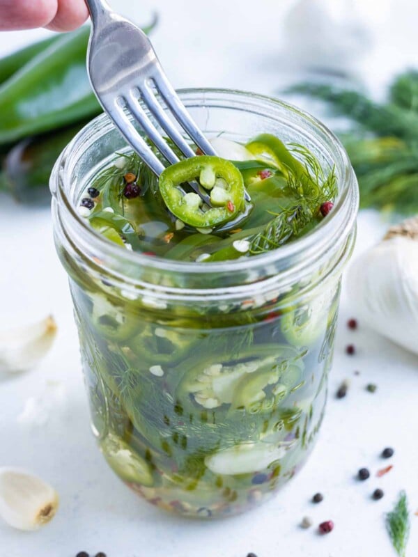 Crisp and flavorful jalapeños in a glass jar.
