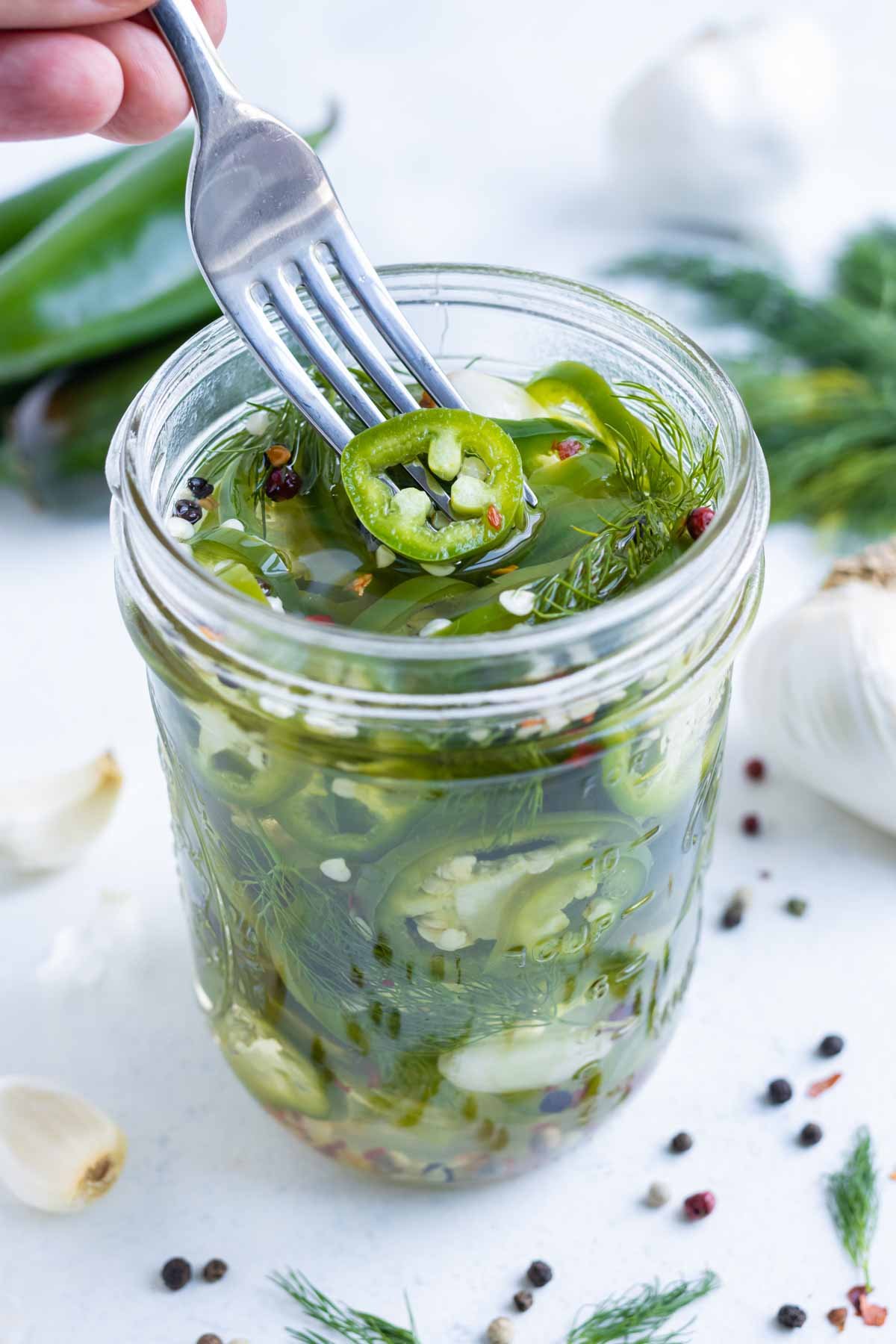 Crisp and flavorful jalapeños in a glass jar.