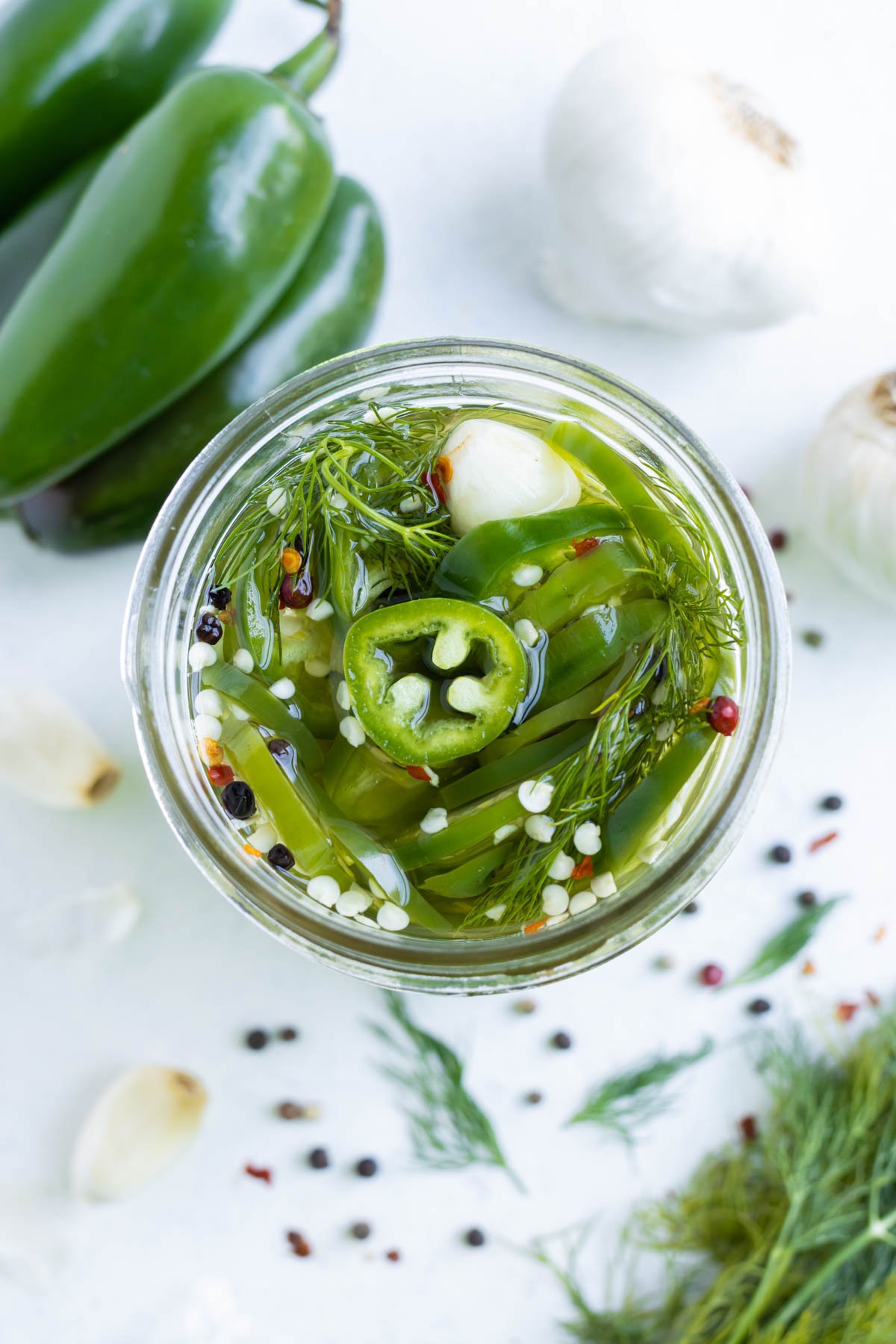 An overhead view of homemade pickled jalapeños.