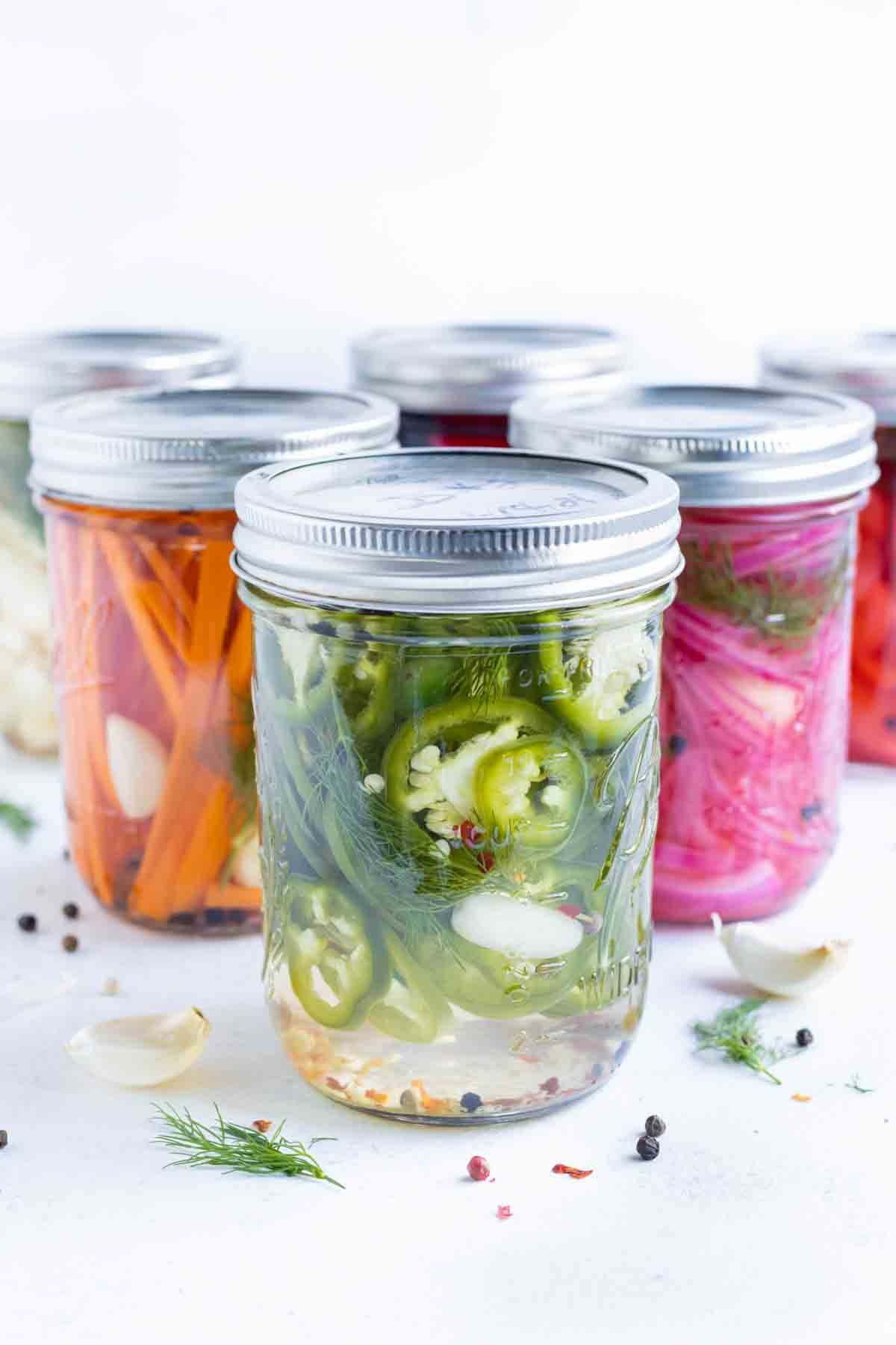 Jars of pickled vegetables in a group.