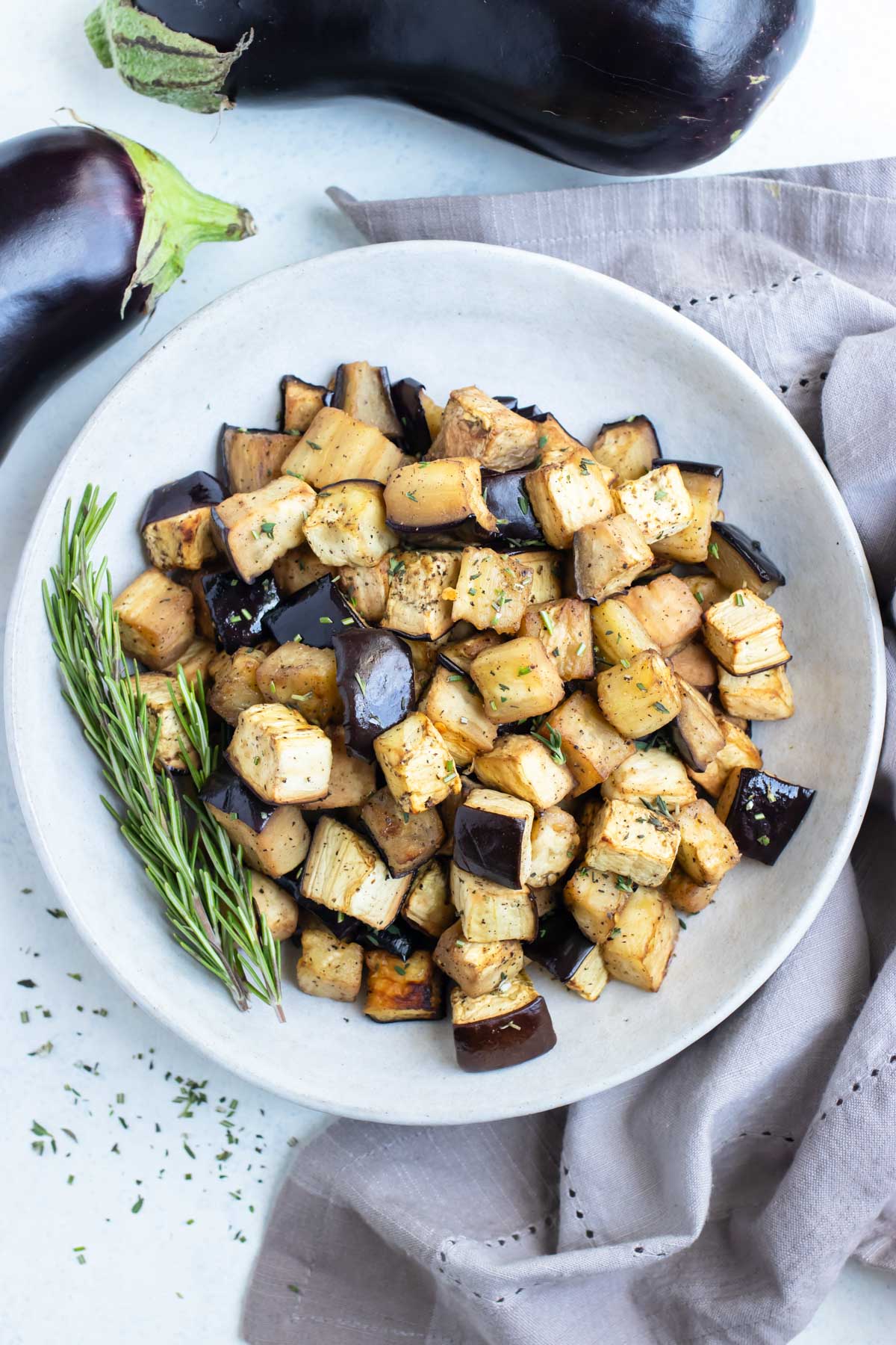 A bowl of roasted eggplant is shown for a healthy side dish.
