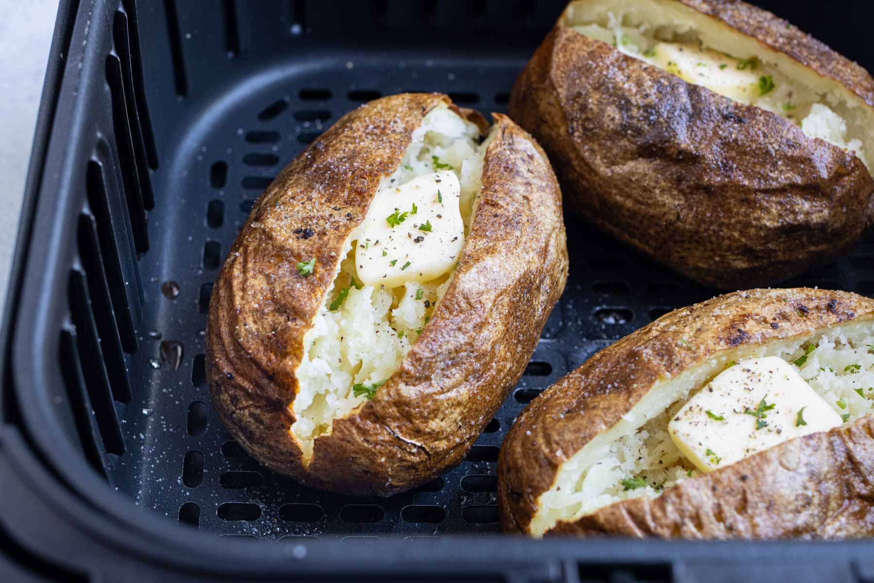 Bake potatoes in the air fryer.