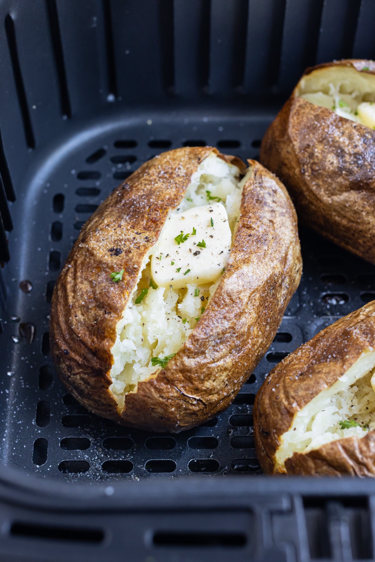 Potatoes are cooked in an air fryer.